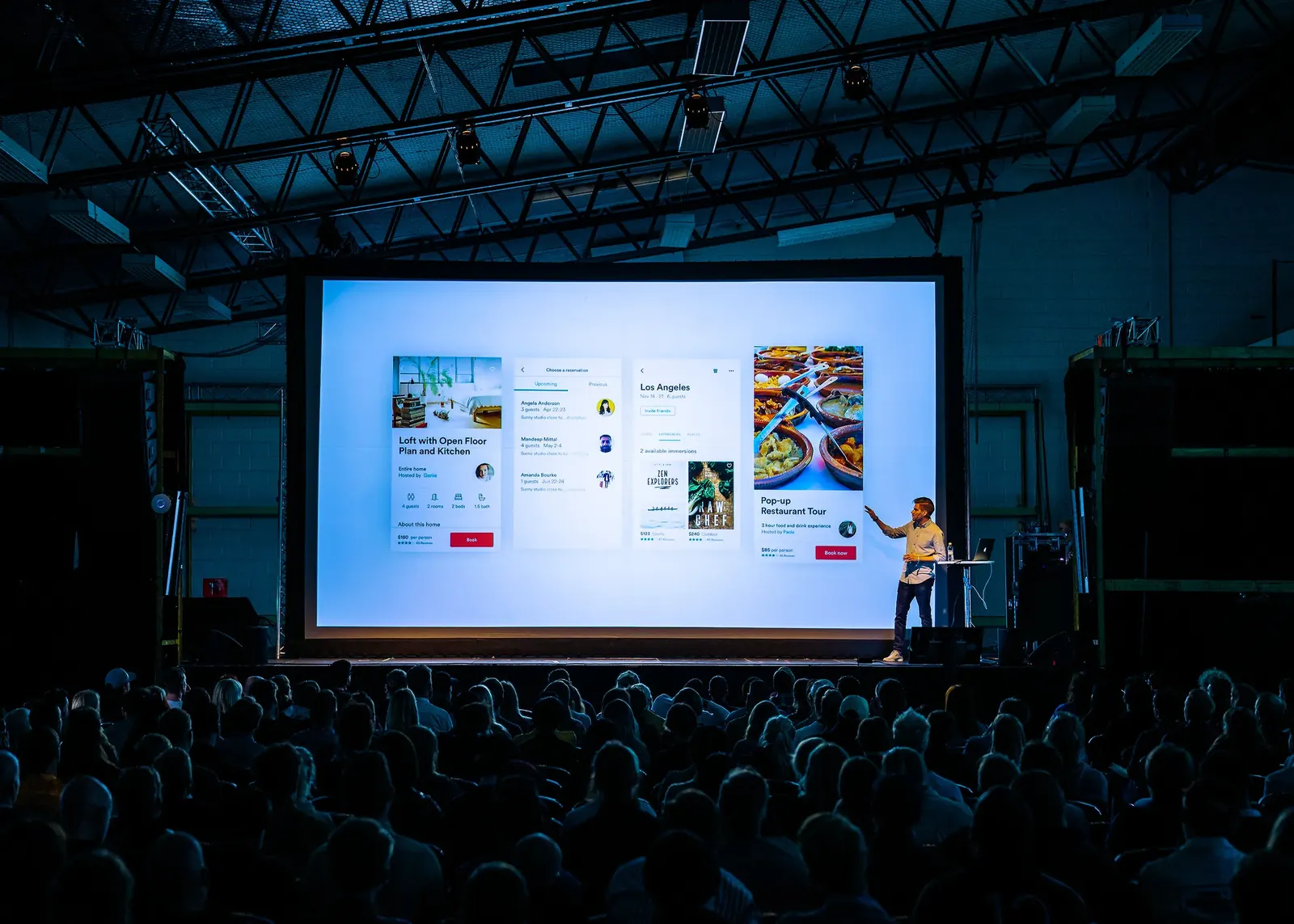 Audience facing a projection screen